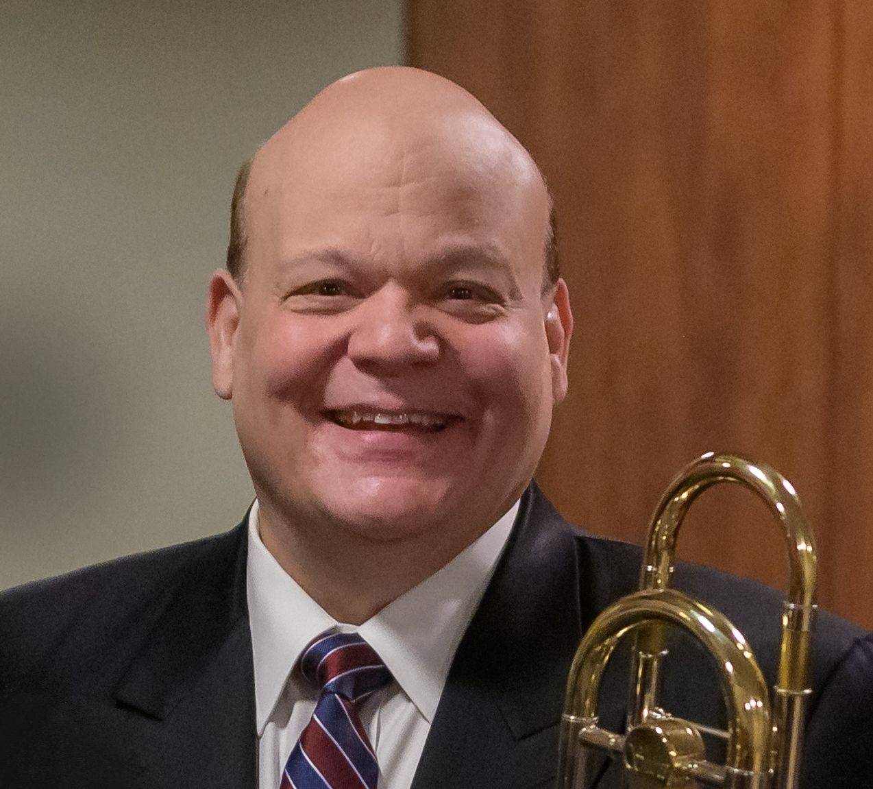 Don Lucas holding a trombone