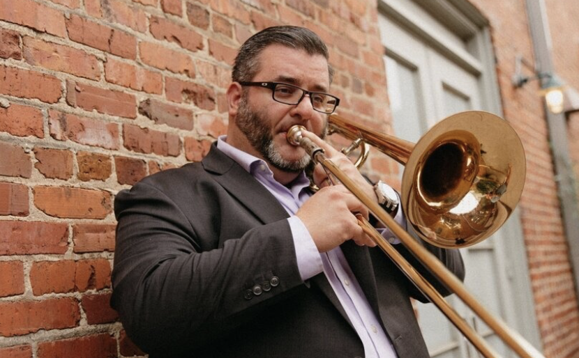 Photo of Ben McIlwain playing the trombone