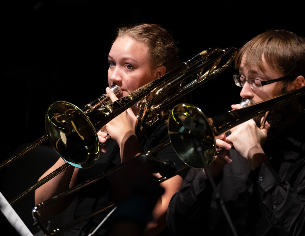 Photo of 2 trombone players in concert at the University of Massachusetts Amherst