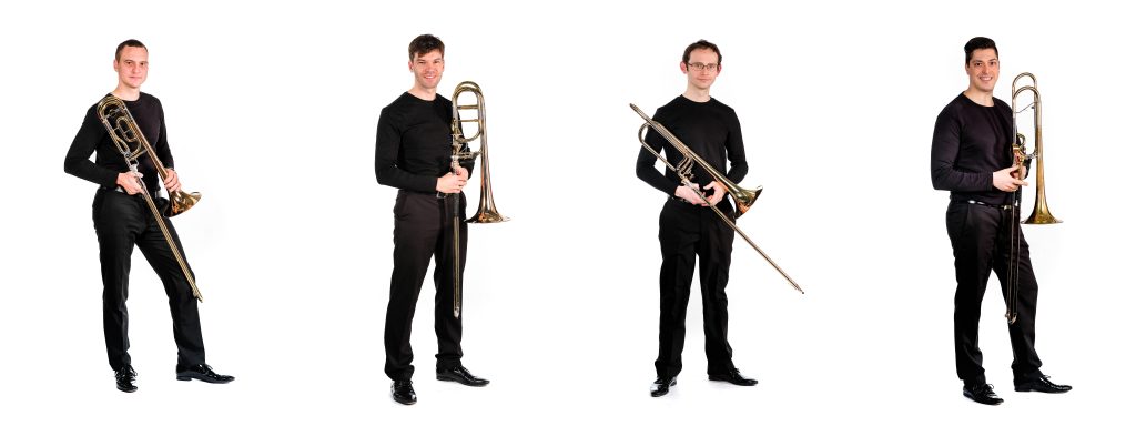 The four members of Trombone Attraction; each one is holding a trombone. Photo credit: Klaus Leherbauer