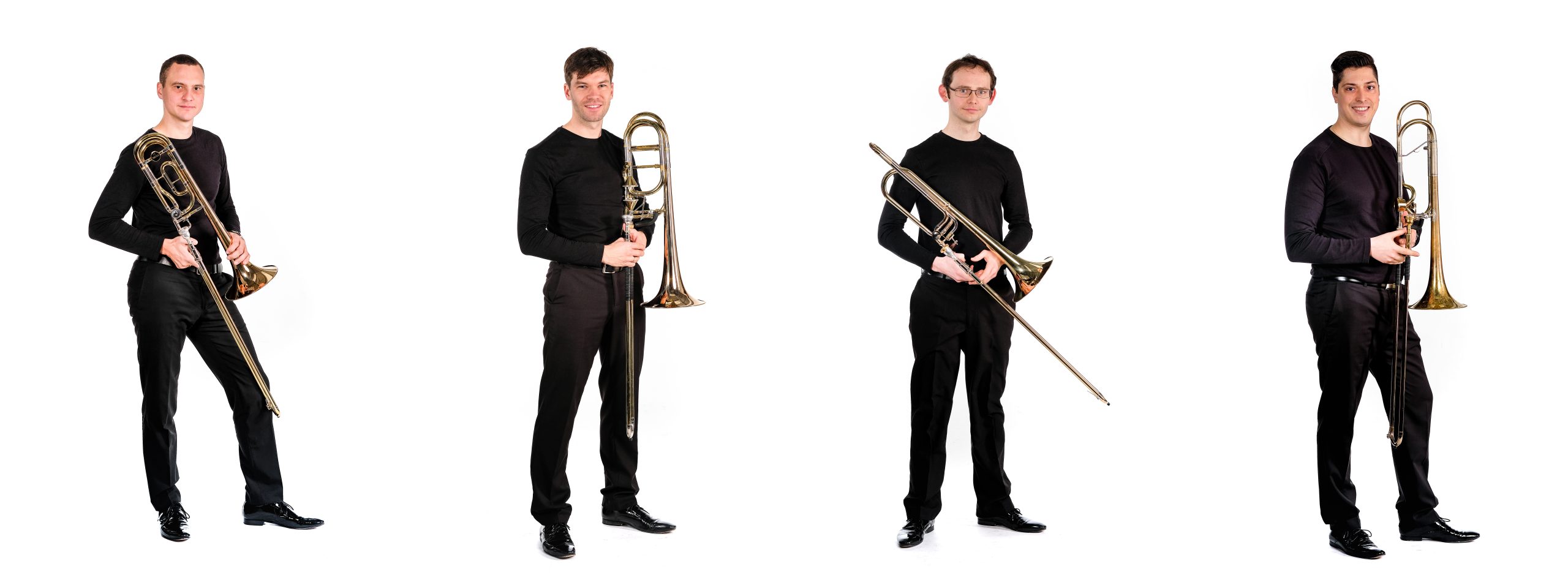 The four members of Trombone Attraction; each one is holding a trombone. Photo credit: Klaus Leherbauer