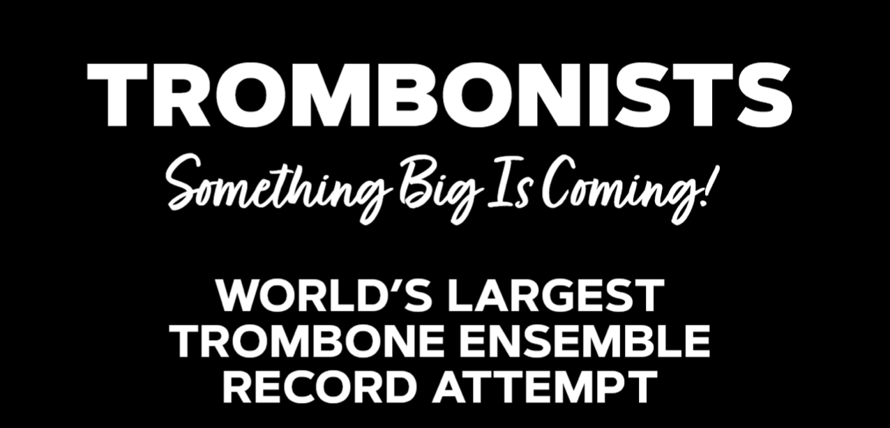 This excerpt from a poster says, "Trombonists - Something big is coming! World's largest trombone ensemble record attempt"